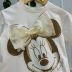 Blusa Infantil Animê Off White Minnie Dourada Laço Em Tule Com Aplicação de Flores Bordadas e Brilho