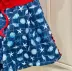 Conjunto Infantil Feminino Petit Cherie Blusa Canelada Vermelha Bordado e Shorts Azul Fundo do Mar