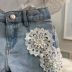 Conjunto Infantil Momi Blusa Off White Babados Shorts Jeans Aplique Flores Off White