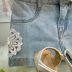 Conjunto Infantil Momi Blusa Off White Babados Shorts Jeans Aplique Flores Off White