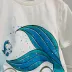 Conjunto Infantil Momi Blusa Off White Pequena Sereia Saia Tule Azul Turquesa Glitter Holográfico