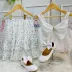 Conjunto Infantil Petit Cherie Blusa Branca Listras Brilho e Laço e Saia Listras Brilho e Flores