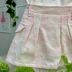 Conjunto Infantil Petit Cherie Blusa Off White Alça Fina Tule Brilho Laços Pérolas Saia Lavagem 