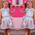 Conjunto Infantil Yoyo Azul Blusa Lisa Laço Amarração Cruzada Costas Pérola  Saia Menina Strass