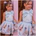 Conjunto Infantil Yoyo Azul Blusa Lisa Laço Amarração Cruzada Costas Pérola  Saia Menina Strass