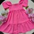 Vestido Infantil Kukiê Rosa Chiclete Colete Jeans com Flores Neon e Pompom